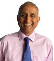 A person wearing a pink shirt and tie

AI-generated content may be incorrect.